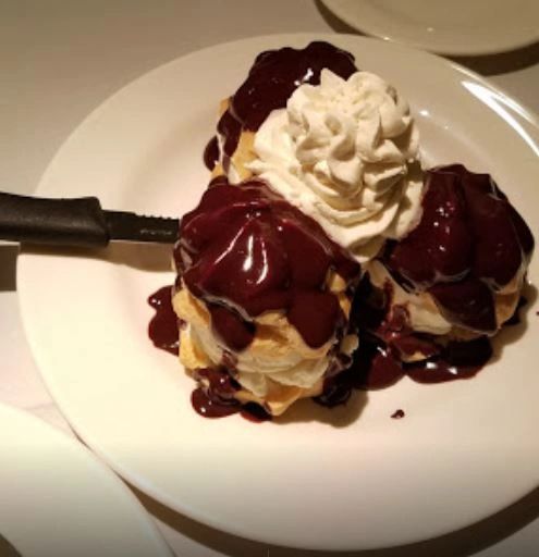 Profiteroles with chocolate sauce dessert